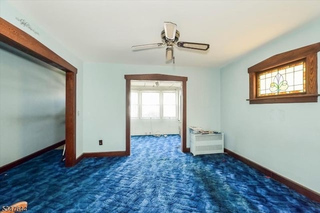unfurnished room featuring baseboards, ceiling fan, and carpet flooring