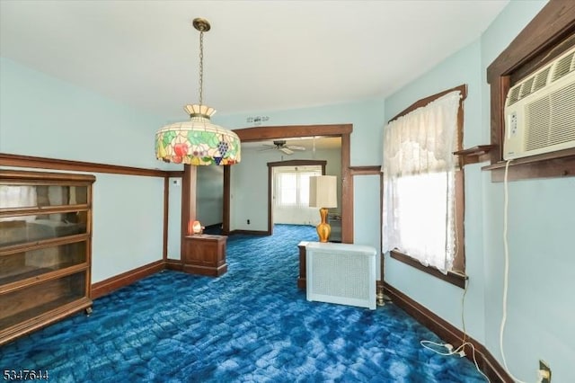 unfurnished room with carpet floors, ceiling fan, and baseboards