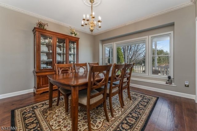 dining area featuring dark wood-style floors, baseboards, a chandelier, and ornamental molding