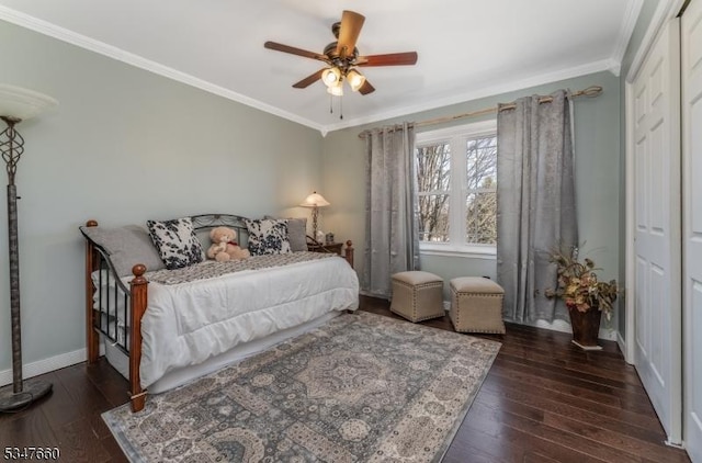 bedroom featuring wood-type flooring, baseboards, crown molding, and ceiling fan