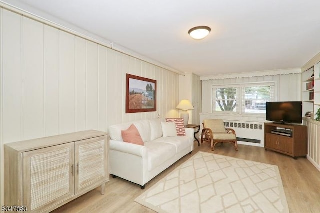 2379 Bryant Ave, Scotch Plains Twp, NJ 07076 - living area with radiator, light wood-style flooring, and ornamental molding