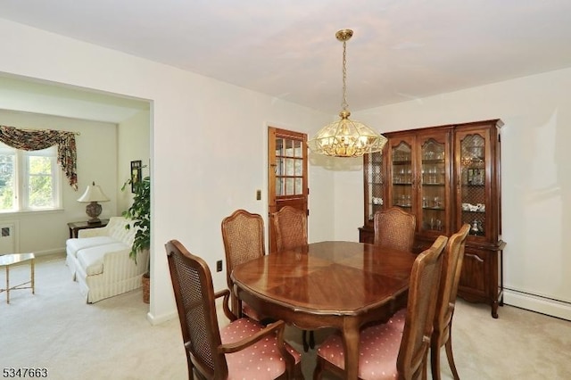 2379 Bryant Ave, Scotch Plains Twp, NJ 07076 - dining area with a chandelier, light colored carpet, a baseboard heating unit, and radiator
