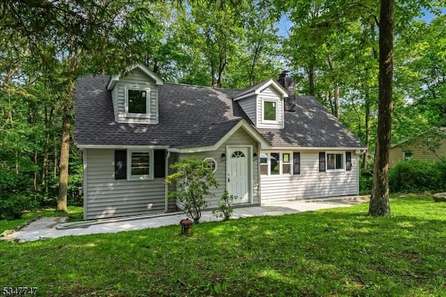 7 Mondamin Rd, Vernon Twp, NJ 07422 - cape cod home featuring a chimney, a front lawn, and a shingled roof