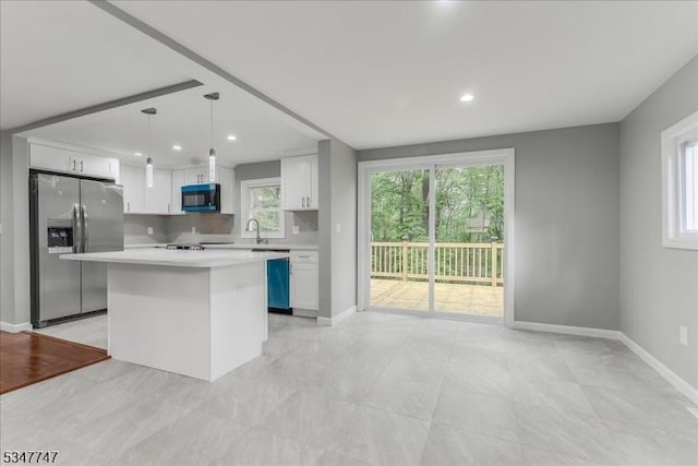 7 Mondamin Rd, Vernon Twp, NJ 07422 - kitchen with stainless steel refrigerator with ice dispenser, black microwave, light countertops, white cabinets, and a kitchen island