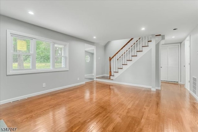 7 Mondamin Rd, Vernon Twp, NJ 07422 - unfurnished living room featuring light wood finished floors, stairway, and recessed lighting