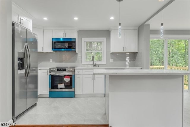 7 Mondamin Rd, Vernon Twp, NJ 07422 - kitchen featuring appliances with stainless steel finishes, light countertops, white cabinetry, and recessed lighting