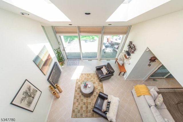 204 Barringer Ct, West Orange Twp, NJ 07052 - living room with expansive windows and a skylight