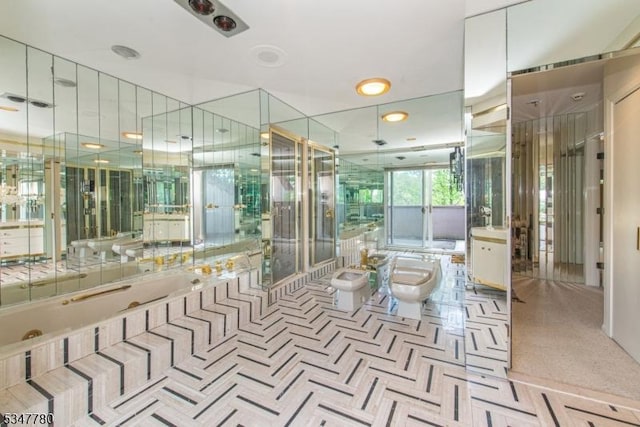 204 Barringer Ct, West Orange Twp, NJ 07052 - bathroom featuring a bidet, a whirlpool tub, toilet, and a stall shower
