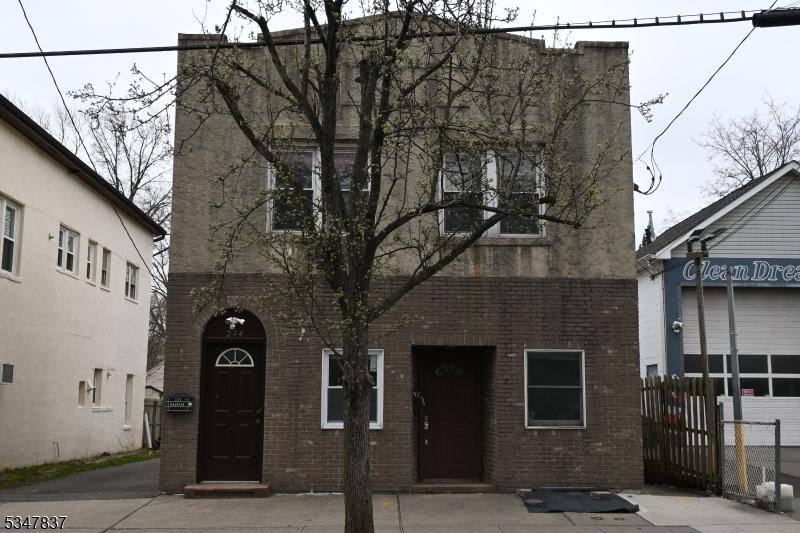 244 W Scott Ave, Rahway City, NJ 07065 - view of front facade with brick siding and fence