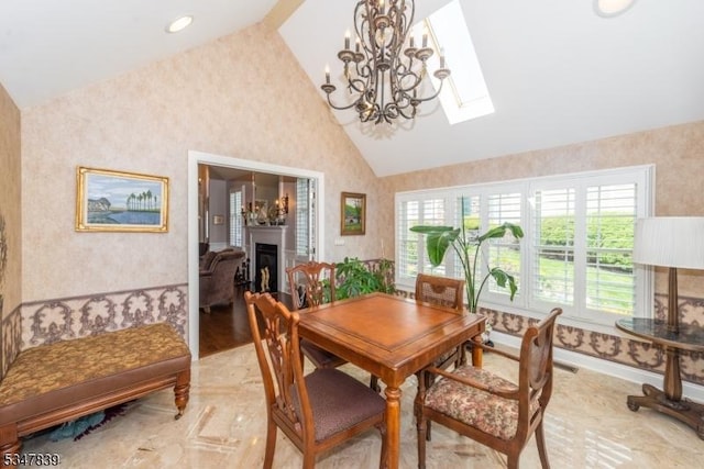 dining area with a chandelier, wallpapered walls, and lofted ceiling with skylight