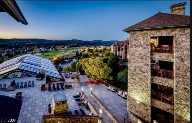 birds eye view of property with a mountain view
