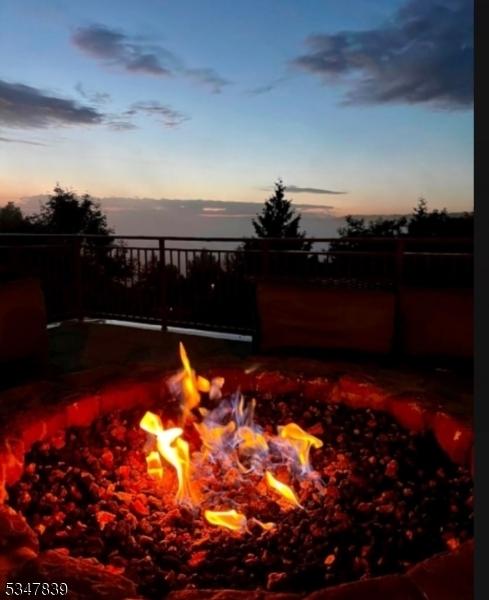 view of patio / terrace featuring an outdoor fire pit