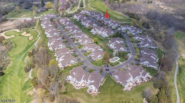 birds eye view of property with a residential view and view of golf course