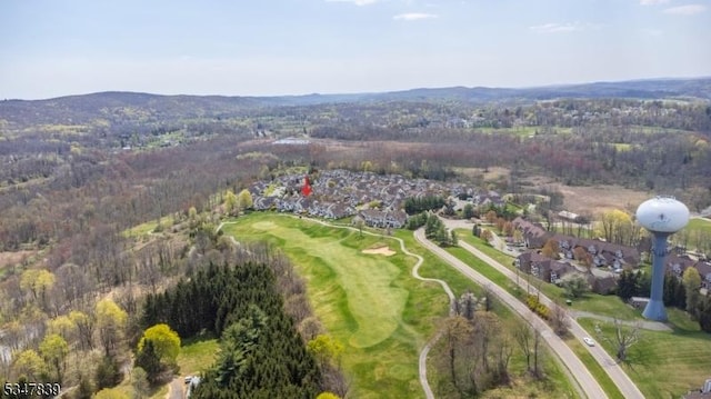 bird's eye view with a mountain view and view of golf course