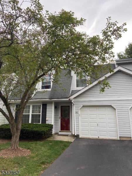 view of front facade with driveway and a garage