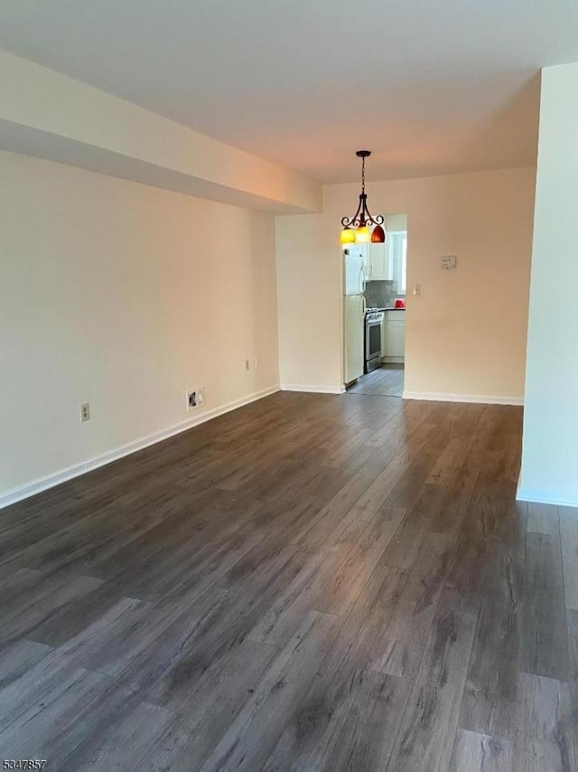 interior space featuring baseboards and dark wood-style flooring