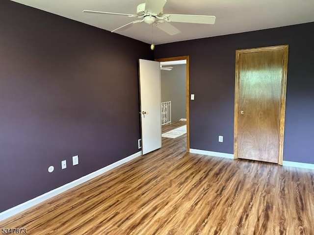 913 Renate Dr Unit 2, Hillsborough Twp, NJ 08844 - unfurnished bedroom with wood finished floors, baseboards, and a ceiling fan