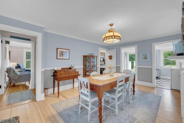 28 Academy St, Califon Boro, NJ 07830 - dining room with light wood-type flooring, a chandelier, baseboards, and ornamental molding