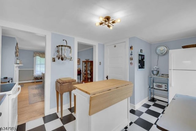 28 Academy St, Califon Boro, NJ 07830 - kitchen with freestanding refrigerator, tile patterned floors, stove, butcher block counters, and baseboards