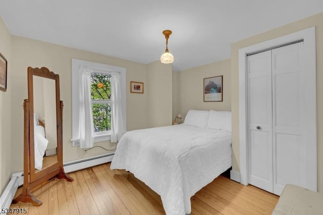 28 Academy St, Califon Boro, NJ 07830 - bedroom featuring baseboard heating, light wood-style floors, and baseboards