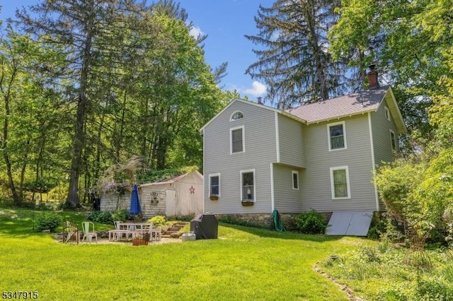 28 Academy St, Califon Boro, NJ 07830 - rear view of house with a chimney and a lawn