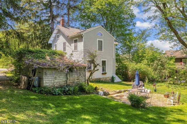 28 Academy St, Califon Boro, NJ 07830 - rear view of property with a chimney, a patio, and a yard
