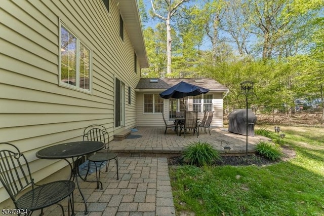 view of patio with a grill