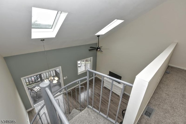 3 Davos Dr Unit 6, Vernon Twp, NJ 07462 - stairs with high vaulted ceiling, visible vents, a skylight, wood finished floors, and baseboards
