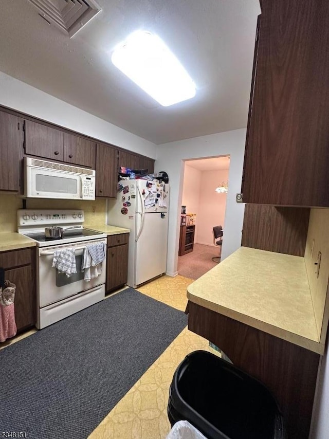 3 Meadowview Dr, Clinton Twp, NJ 08801 - kitchen featuring white appliances, light floors, light countertops, and dark brown cabinetry