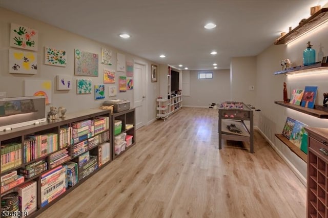 recreation room featuring baseboards, recessed lighting, and wood finished floors