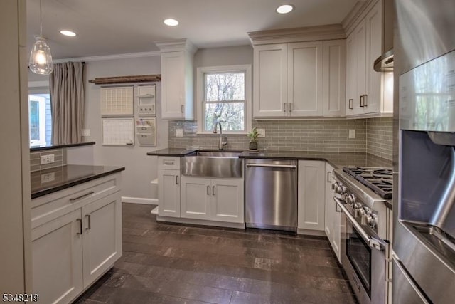 kitchen with backsplash, stainless steel appliances, recessed lighting, and a sink