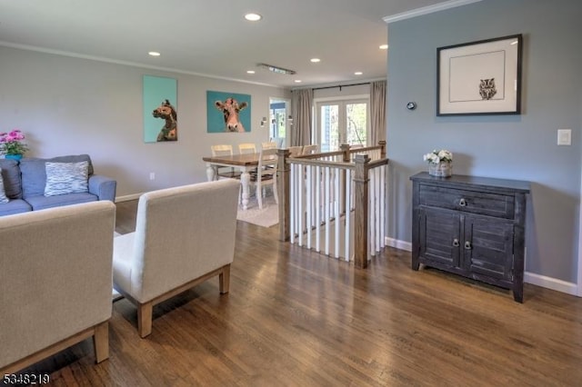 living room with ornamental molding, recessed lighting, wood finished floors, and baseboards