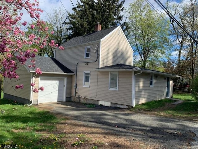 826 Green Pond Rd, Rockaway Twp, NJ 07866 - view of property exterior with a garage, driveway, and a chimney