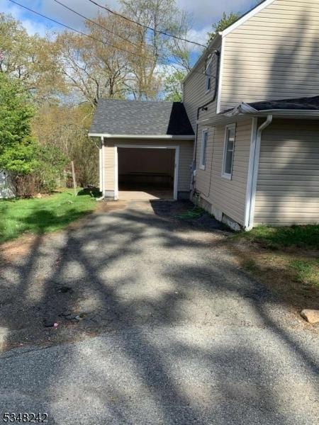 826 Green Pond Rd, Rockaway Twp, NJ 07866 - view of side of property with a garage and asphalt driveway