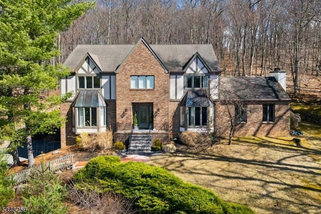 16 James Rd, Randolph Twp, NJ 07869 - tudor home featuring brick siding and a chimney