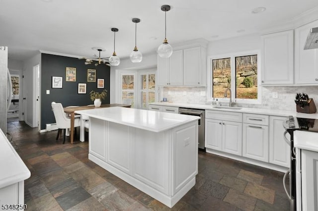 16 James Rd, Randolph Twp, NJ 07869 - kitchen featuring appliances with stainless steel finishes, stone tile floors, tasteful backsplash, white cabinetry, and a kitchen island