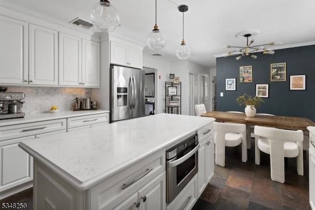 16 James Rd, Randolph Twp, NJ 07869 - kitchen with stainless steel appliances, a chandelier, white cabinets, tasteful backsplash, and dark stone finish floors
