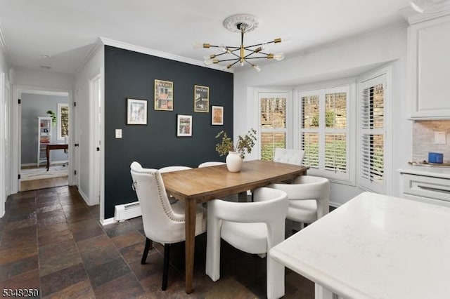 16 James Rd, Randolph Twp, NJ 07869 - dining room featuring a chandelier, stone tile floors, baseboard heating, and ornamental molding