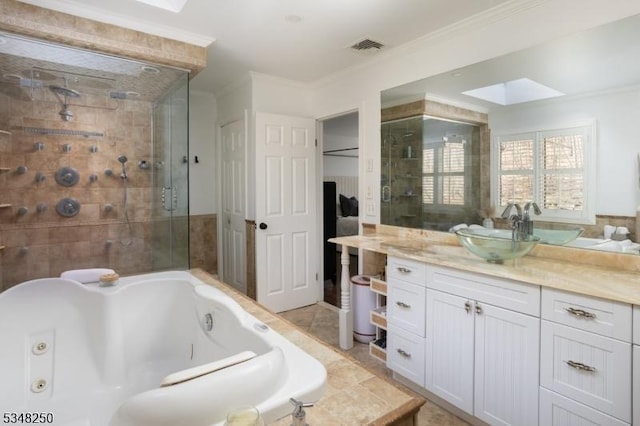 16 James Rd, Randolph Twp, NJ 07869 - full bathroom featuring a skylight, a tub with jets, vanity, ornamental molding, and a shower stall