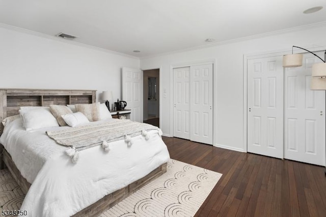 16 James Rd, Randolph Twp, NJ 07869 - bedroom featuring multiple closets, crown molding, and dark wood-type flooring