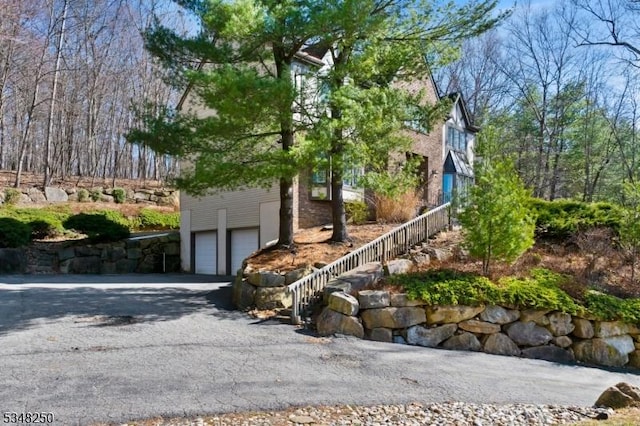16 James Rd, Randolph Twp, NJ 07869 - view of property exterior with a garage, driveway, and stairway