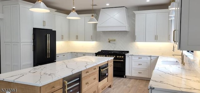 kitchen with a kitchen island, tasteful backsplash, beverage cooler, custom range hood, and black appliances