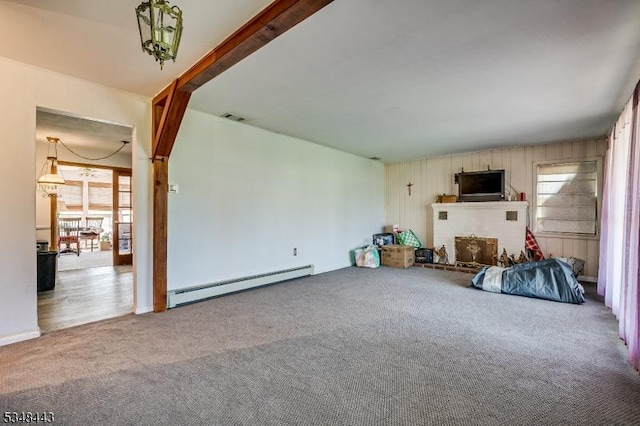 carpeted living area featuring visible vents and a baseboard radiator