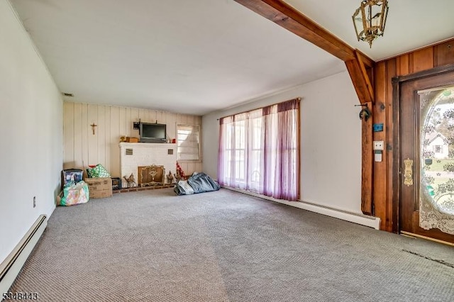 interior space featuring a baseboard heating unit, a baseboard radiator, and wooden walls