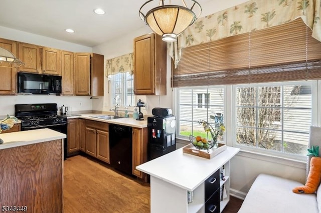 4 Hardenbergh St, Franklin Twp, NJ 08873 - kitchen featuring a sink, light countertops, and black appliances