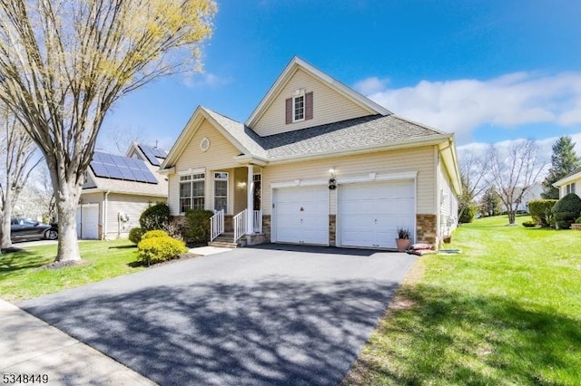 4 Hardenbergh St, Franklin Twp, NJ 08873 - traditional-style home with a garage, stone siding, driveway, and a front lawn