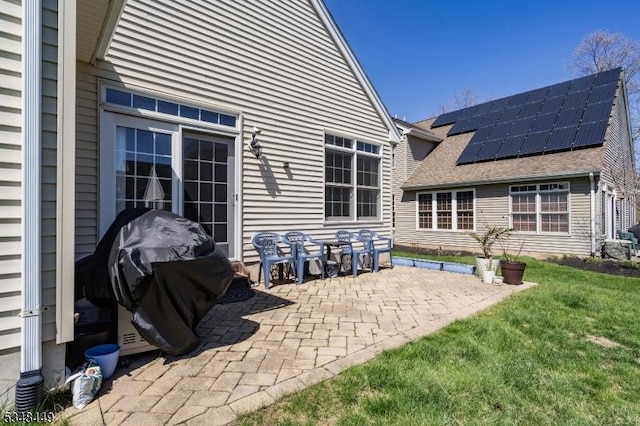 4 Hardenbergh St, Franklin Twp, NJ 08873 - back of house featuring a yard, a patio, solar panels, and roof with shingles