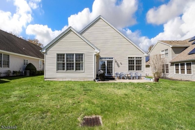 4 Hardenbergh St, Franklin Twp, NJ 08873 - back of property with a patio, central AC unit, and a lawn