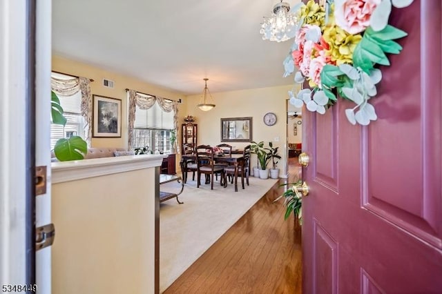 4 Hardenbergh St, Franklin Twp, NJ 08873 - foyer entrance with visible vents, hardwood / wood-style flooring, and an inviting chandelier