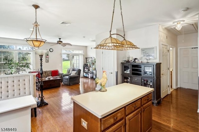 4 Hardenbergh St, Franklin Twp, NJ 08873 - kitchen featuring brown cabinetry, wood finished floors, a ceiling fan, and visible vents